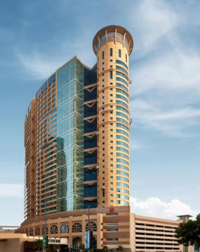Гостиница Grand Millennium Al Wahda Hotel and Executive Apartments Abu Dhabi  Абу-Даби